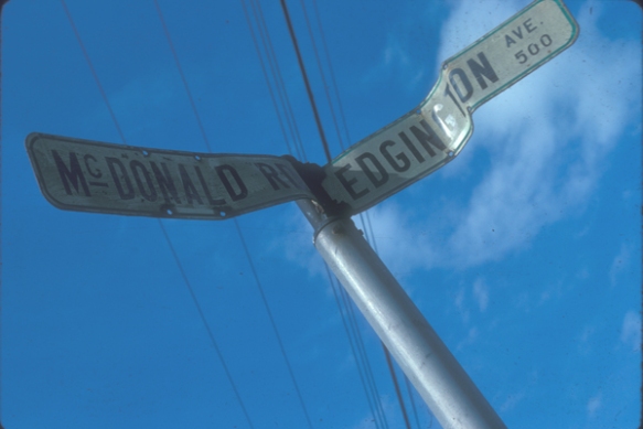 Street sign at corner in the old Cora Brown subdivision. McDonald Road (still in existence) was named after pioneer farming family on Sea Island. Edgington Avenue (disappeared with the federal expropriation of Cora Brown for airport expansion)  was named after Private Erine Edgington, a former Richmond High student, who was killed in action in Italy during World War II. City of Richmond Archives Photograph 1997 42 1 483 